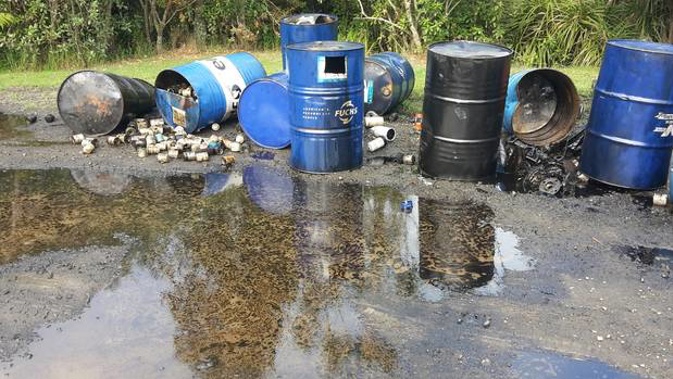 Oil and oil filters dumped on Piha Rd. Photo / Sarah Munro