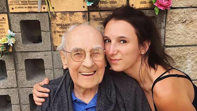 Olivia Moore with her late poppa Ian Nicoll, who's plaque and ashes were stolen from Paparoa Cemetery. (Photo / Supplied)