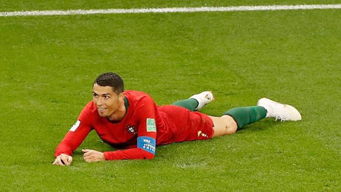 Portugal's Cristiano Ronaldo smiles on the pitch during the group B match between Iran and Portugal. Photo / AP