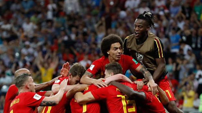 Belgium players celebrate a famous win over Japan at the Fifa World Cup. Photo / AP