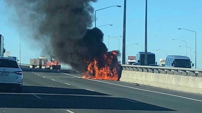The car fire is blocking two lanes of the Southwestern Motorway. (Photo / Chris Cook)