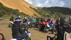 A gathering of motorbikes at Ahipara, where fences are about to be erected to protect vulnerable landscapes and ecological sites. 