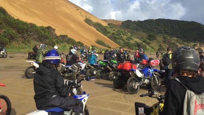 A gathering of motorbikes at Ahipara, where fences are about to be erected to protect vulnerable landscapes and ecological sites. 