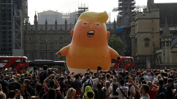 The cartoon blimp of 'Baby Trump' will follow the US President's tour of the UK. (Photo / AP)