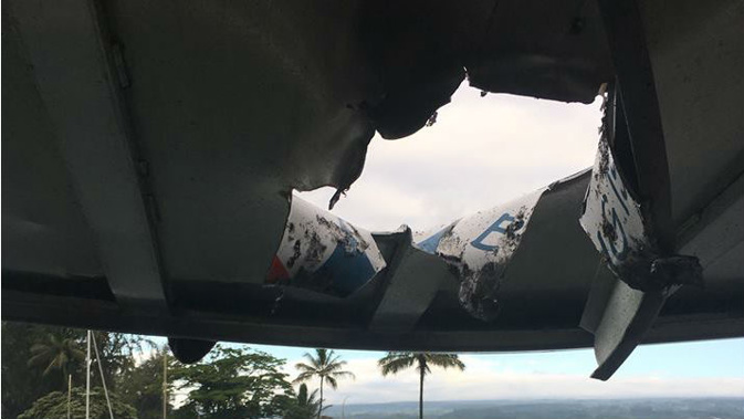 The lava burst through the roof of a boat an hour away from the volcano. (Photo / Twitter)