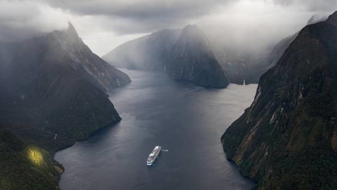Megaliner Ovation of the Seas enters in Milford Sound in Fiordland. Photo / James Allan