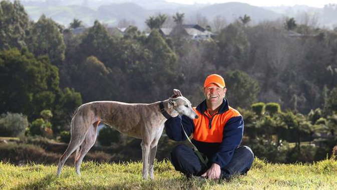 Reiss Jenkinson and his greyhound named Gracie at the site where Jenkinson plans to build a house and a family. Photo / John Borren
