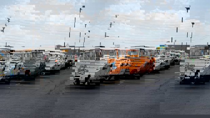 Duck boats sit idle in the parking lot of Ride the Ducks, in Branson. The amphibious vehicles are similar to one of the company's boats that capsized. Photo / AP