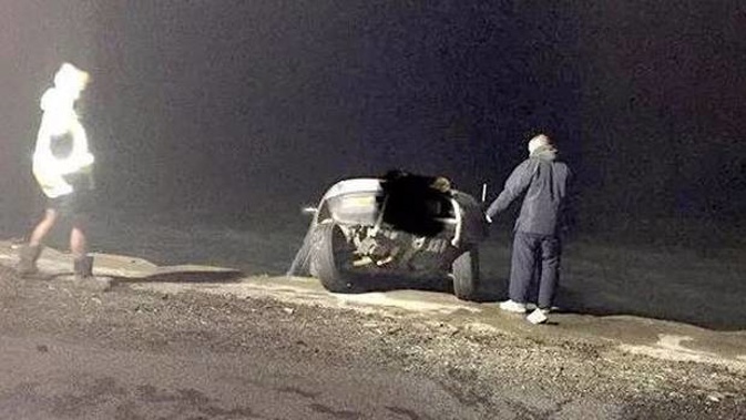 The car reversed back over the seawall. Photo / Facebook