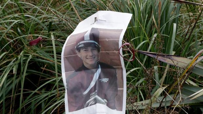A photo from a student newspaper article from the Marjory Stoneman Douglas High School in Parkland, is attached to a tree planted at Halswell Quarry Park Conservation Area, Christchurch. Photos / AP