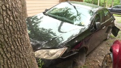 The family's Lexus had to be towed from the scene. (Photo / CNN)