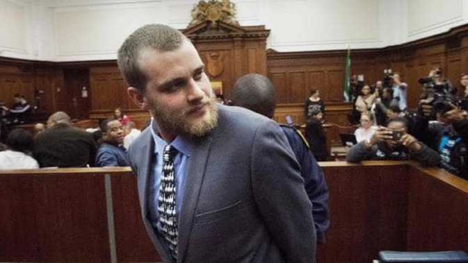 Van Breda is handcuffed and led out of court after being sentenced. (Photo / AFP)