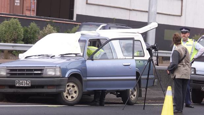 Police work at the scene of the Southern Motorway accident near Greenlane on November 20, 2000, where Eddie Tavinor was killed. (Photo / NZ Herald)