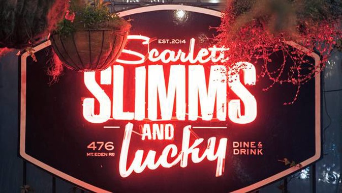 The neon sign outside Scarlett Slimms and Lucky in Mt Eden has been stolen. Photo / Facebook