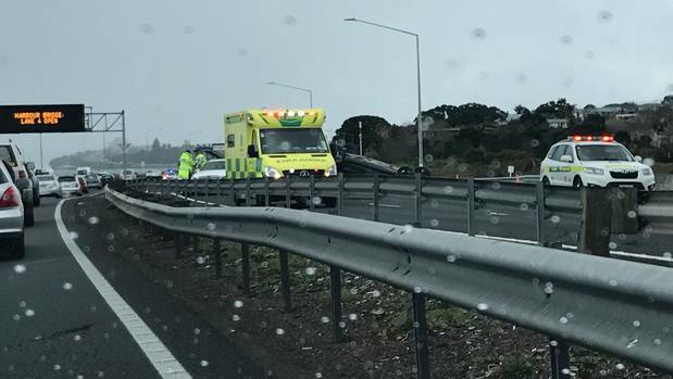 A car that has flipped has caused major delays on Auckland's Northern motorway. (Photo / Supplied)
