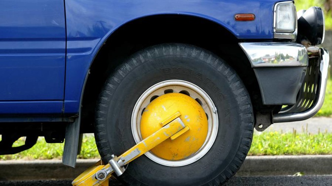Businesses face fines for abusing wheel clamping practices. (Photo / NZ Herald)
