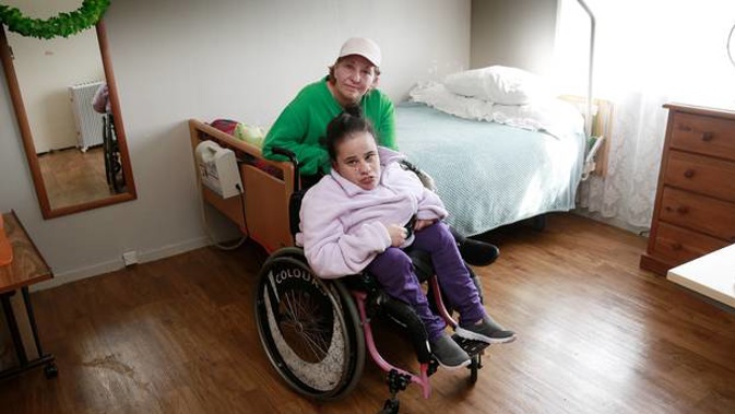 The lift for Josie Haurua's wheelchair outside their Glenfield home has been broken since midway through July. Photo / Doug Sherring