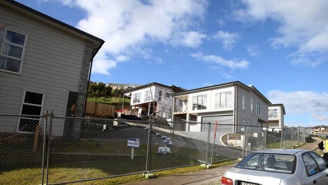 The failed Bella Vista Homes development site at The Lakes fenced and guarded by security. Photo / John Borren