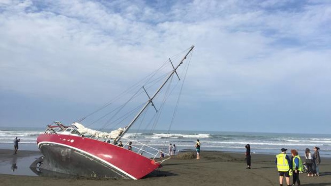 A yacht lies stranded on the beach at New Brighton, Christchurch, the day after the owner ran aground and swam to shore. (Photo / Kurt Bayer)