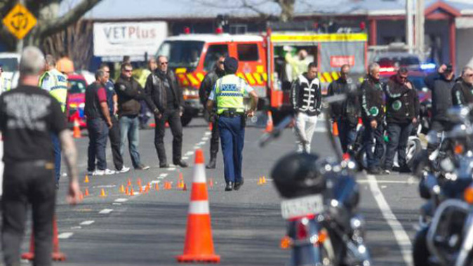 Police and other motorcyclists at the Reparoa crash scene. (Photo: Ben Fraser)