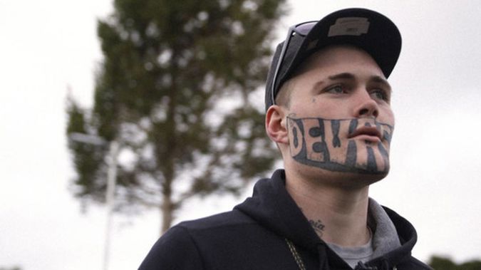 The man with the word Devast8 tattooed across his face is back before the courts. (photo/ NZ Herald)