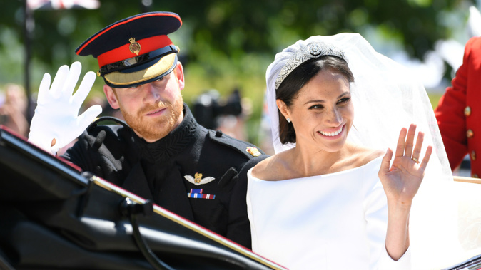 Meghan Markle included a reminder of her first date with Harry in her wedding dress (Image / Getty Images)