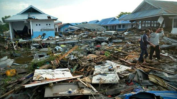 A powerful earthquake rocked the Indonesian island of Sulawesi on Friday, triggering a 3m tall tsunami that an official said swept away houses in at least two cities.