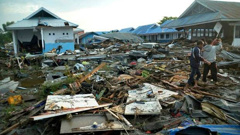 A powerful earthquake rocked the Indonesian island of Sulawesi on Friday, triggering a 3m tall tsunami that an official said swept away houses in at least two cities.