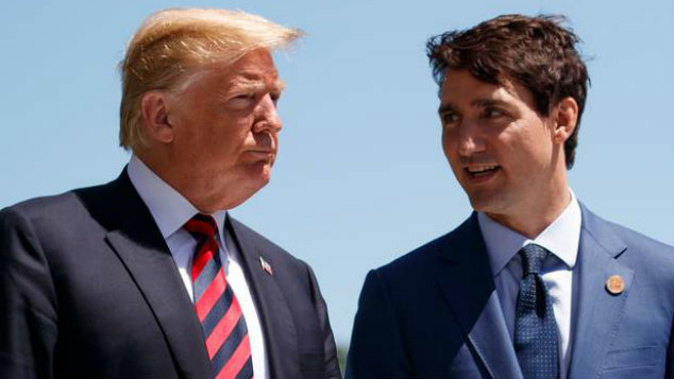 Canada's Prime Minister Justin Trudeau meets with US President Donald Trump at the G7 leaders summit in Quebec. (Photo /  AP)