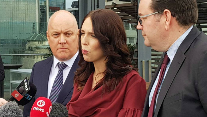 Air New Zealand chief executive Christopher Luxon with Prime Minister Jacinda Ardern and Finance Minister Grant Robertson. 