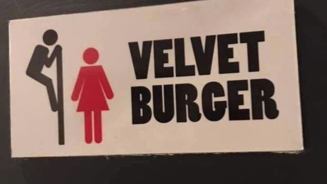 This sign in Velvet Burger's Fort St store in Auckland CBD, apparently indicated three self-contained toilets were unisex. (Photo / Supplied)