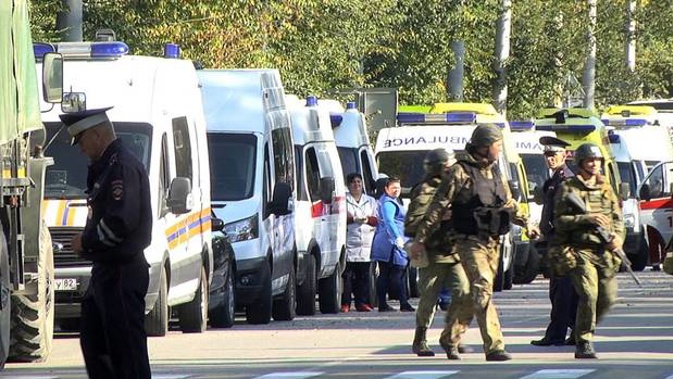Ambulances and Federal National Guard officers near the building of the Kerch Polytechnic Vocational School in the city of Kerch in the aftermath of a mass shooting attack. Photo / Reuters