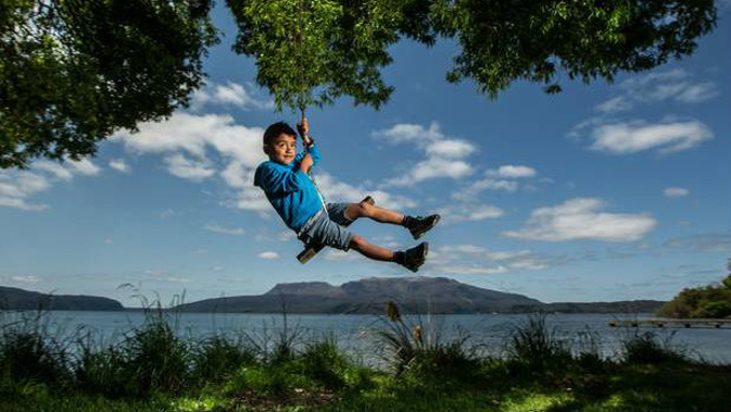 The sunny weather drew plenty of people outside around the country including Zac McIlroy, 5, at Lake Tarawera. Photo / NZME