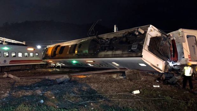 Train carriages are scattered at the site of a train derailment in Lian in northern Taiwan. Photos / AP