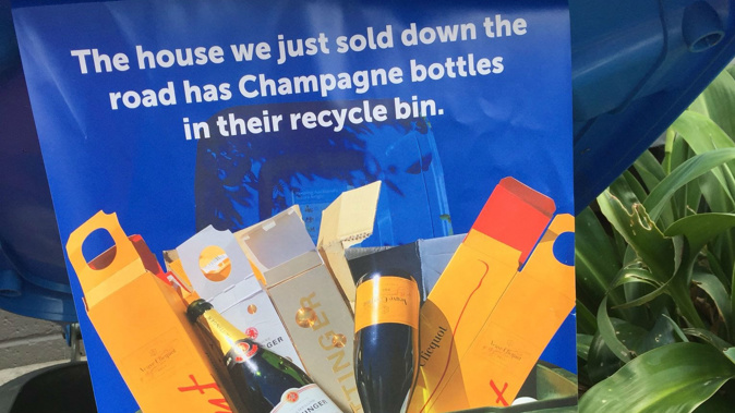 Real estate marketing material has shown up inside Auckland bins. (Photo / Twitter)