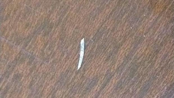 The shard of glass, between 3 to 4mm, that a Huntly man says was in a banana he was eating. (Photo / Supplied)