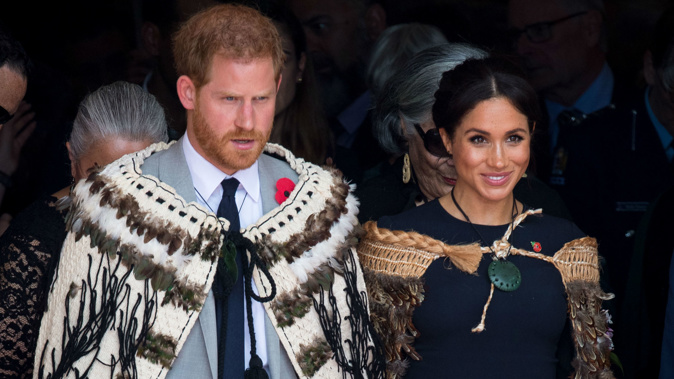 Prince Harry and Meghan Markle  wear traditional Maori cloaks called Korowai during a visit to Rotorua. Photo / Getty Images