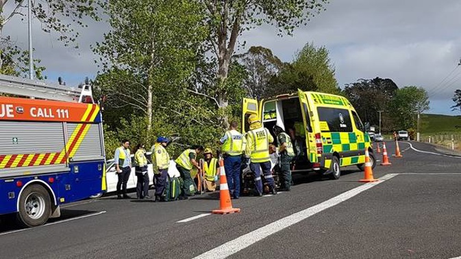 Emergency services attend to the injured at the scene of a crash near Mangonui. Photo / Peter de Graaf