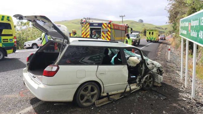 Three adults and two children in this Subaru stationwagon were injured with one child and a grandmother being flown to Whangarei Hospital. Photo / Peter de Graaf