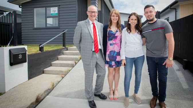 Phil Twyford and Jacinda Ardern welcomed some of the new home owners into their KiwiBuild property last month. (Photo / NZ Herald)