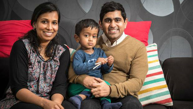 Ani Ravi, pictured with his mother Vinaya Ravi and father Ravi Balasubramanian, has food intolerances and eczema which meant he could not attend daycare all day. Photo / Michael Craig
