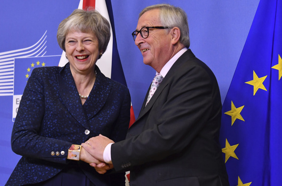 European Commission President Jean Claude Juncker and Theresa May. Photo / AP