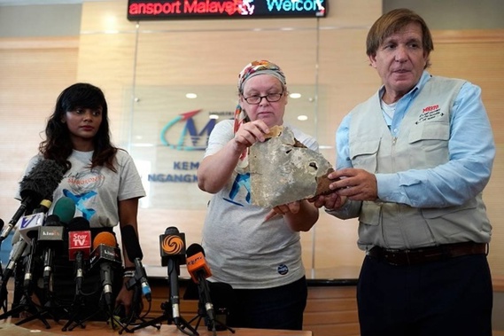 Family members held a press conference to unveil debris they believe is from the missing plane. (Photo / AP)