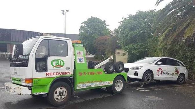 A tow truck driver has been slammed after attempting to tow away a Blind Foundation vehicle carrying two guide dogs in the back. Photo / Supplied