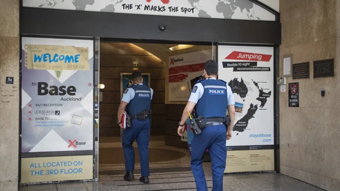 Police enter the Base Backpackers where British backpacker Grace Millane stayed before she was killed. (Photo / Greg Bowker)