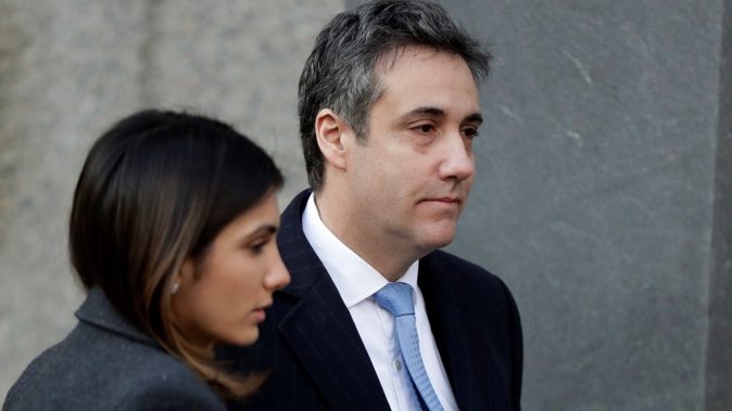 Michael Cohen, right, President Donald Trump's former lawyer, arrives at federal court for his sentencing for dodging taxes, lying to Congress and violating campaign finance laws in New York on Wednesday, Dec. 12, 2018. (AP Photo/Julio Cortez)