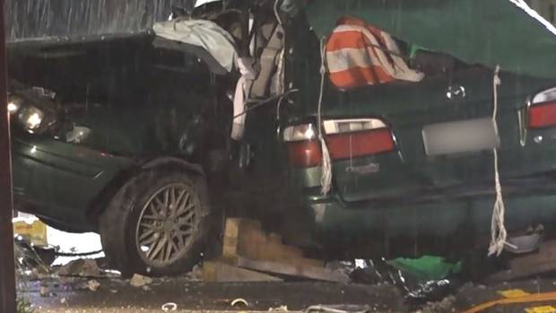 The green Mazda was wrapped around the power pole in the fatal Green Bay crash. Image / Sam Sword