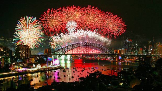 Fireworks explode over the Sydney Harbour Bridge during the midnight display on New Year's Eve on Sydney Harbour. Photo / Getty