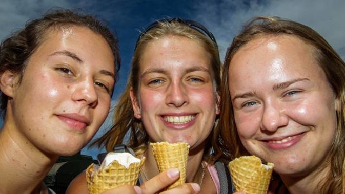 Milena Borbe, left, Karoline Warm, Laura Heubeck, of Germany, tuck into some Hawke's Bay ice cream on Thursday. Photo / Paul Taylor