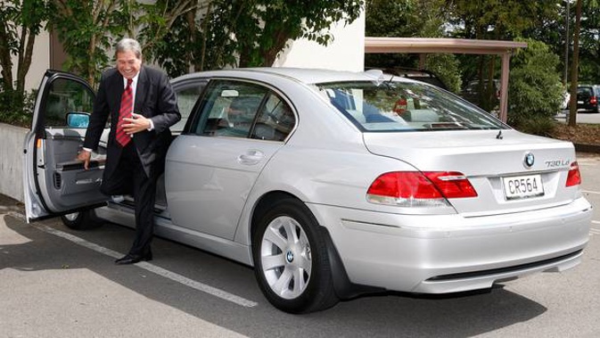 New Zealand First leader Winston Peters getting out of a chauffeur-driven ministerial car, a 7-Series BMW, while on the campaign trail in Hamilton.